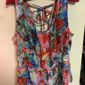 Sheer peplum top with back lace up detail